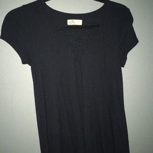 black shirt with crosses in front